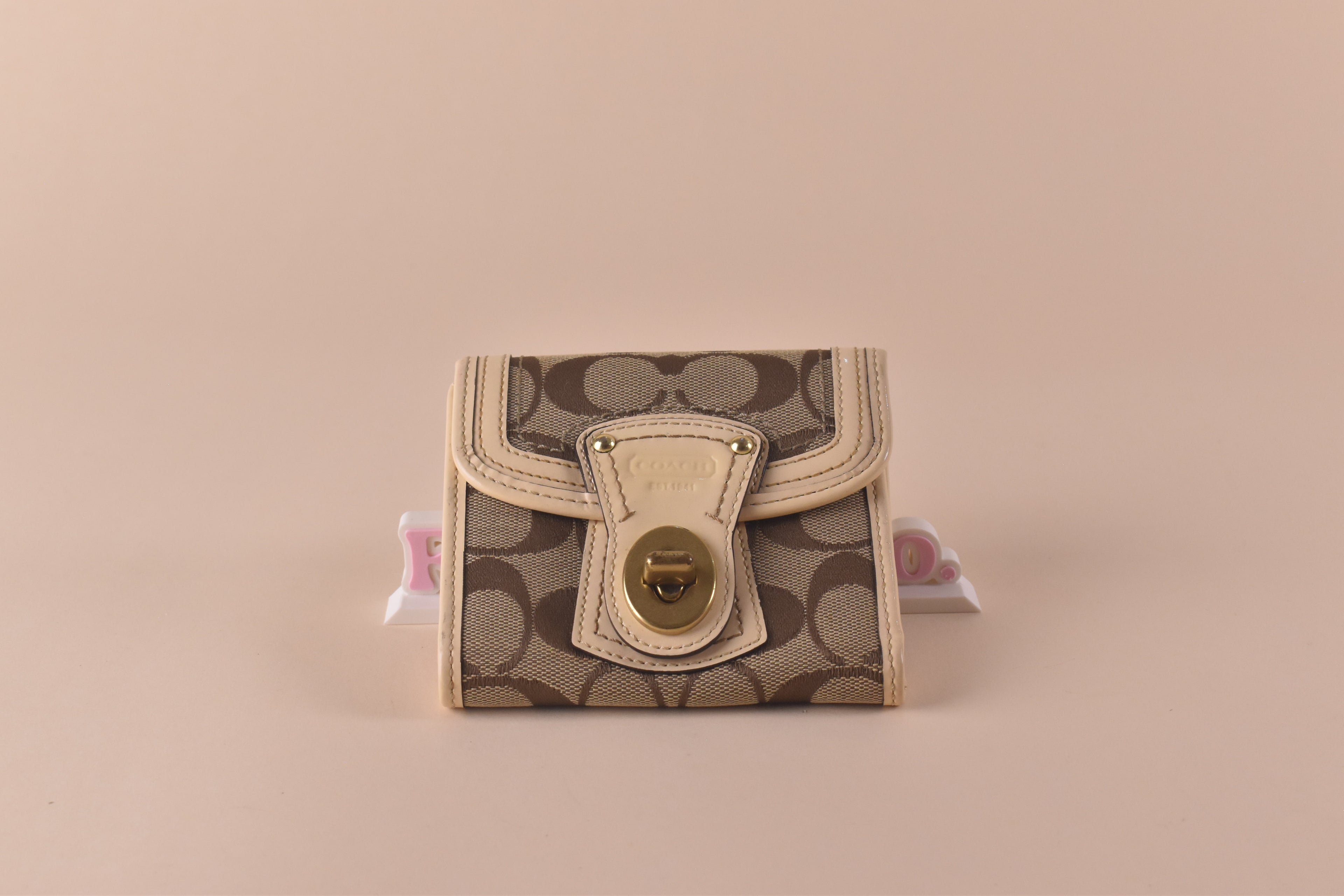 Coach Signature Turnlock Trifold Wallet