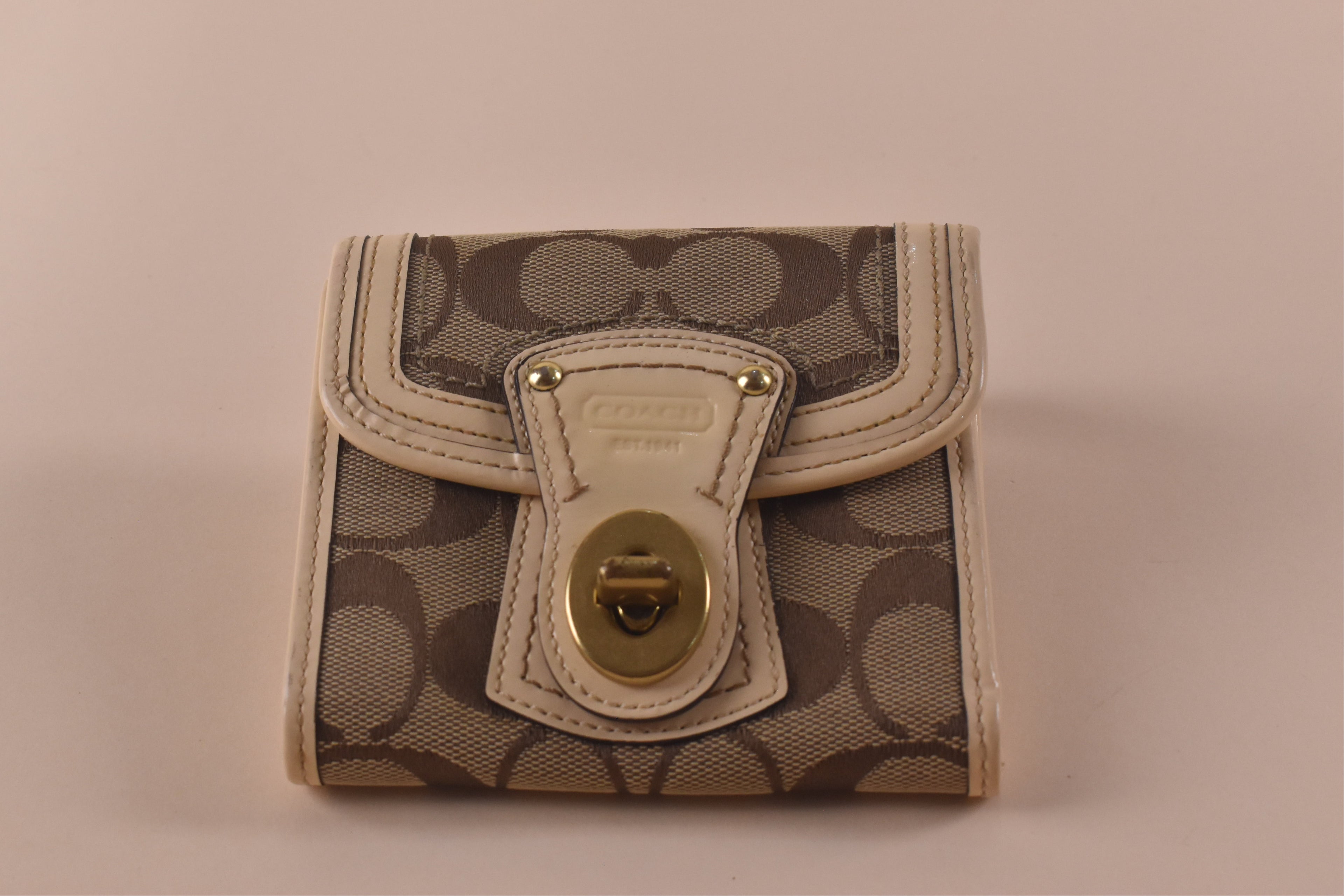 Coach Signature Turnlock Trifold Wallet