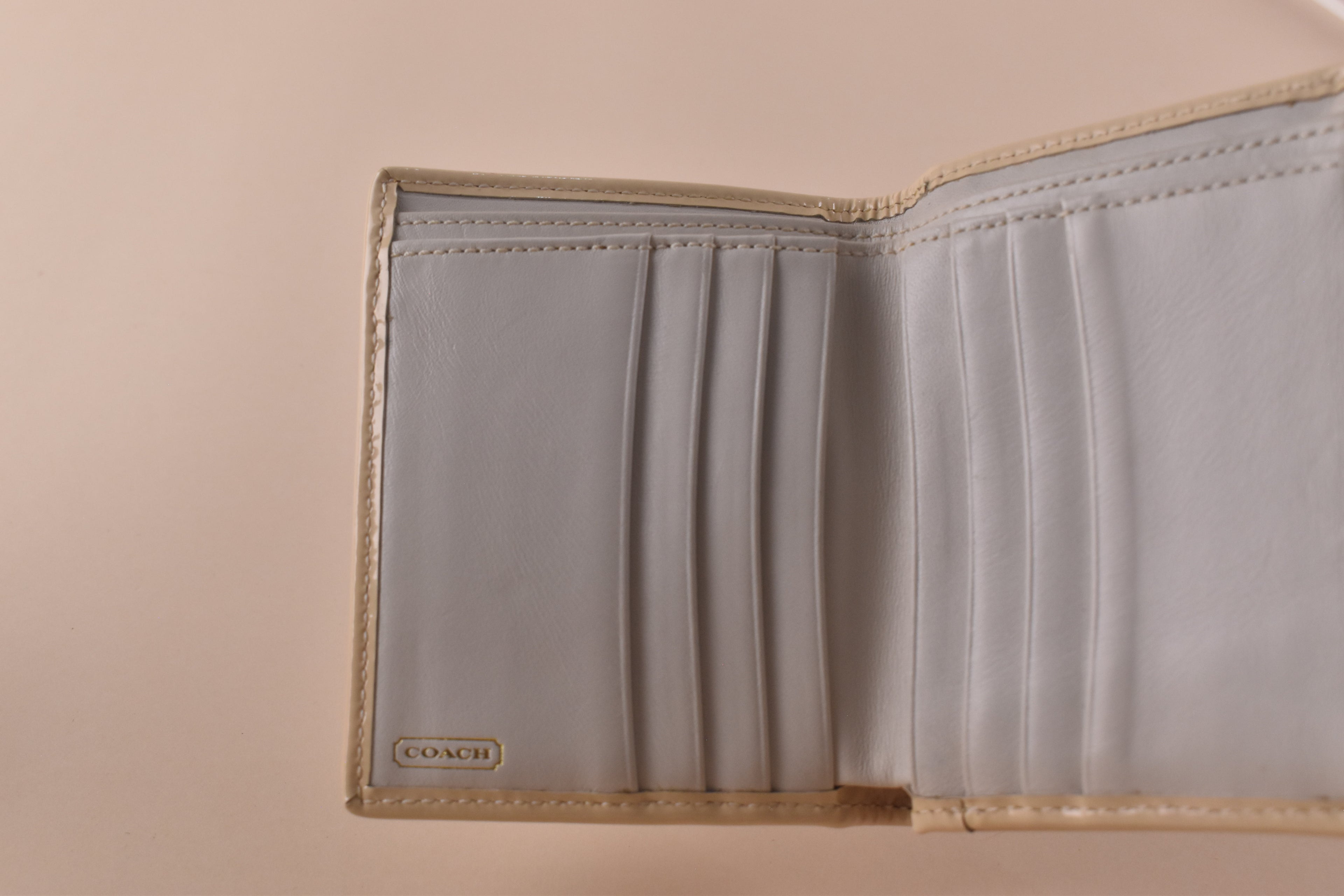 Coach Signature Turnlock Trifold Wallet